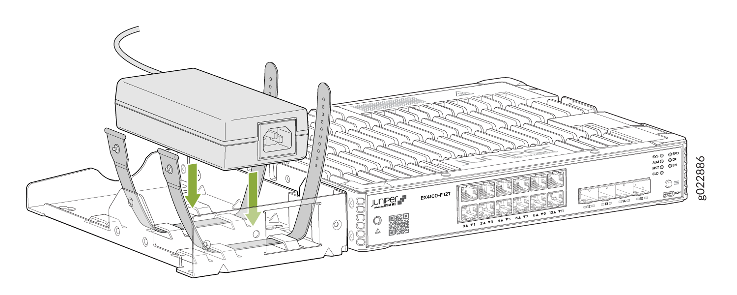 Juniper Networks EX4100-F-12T switch with power adapter being inserted into mounting bracket using green arrows for guidance.