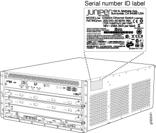Juniper Networks EX9204 Ethernet Switch with highlighted serial number ID label location, showing model number, power ratings, compliance certifications, and serial number.