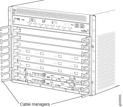 Juniper Networks rack device with front view showing slots for modules and side cable managers, likely a network switch or router.