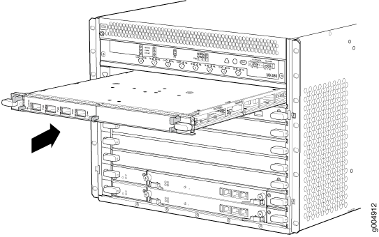 Line card being inserted into a network chassis with an arrow indicating the direction of movement.