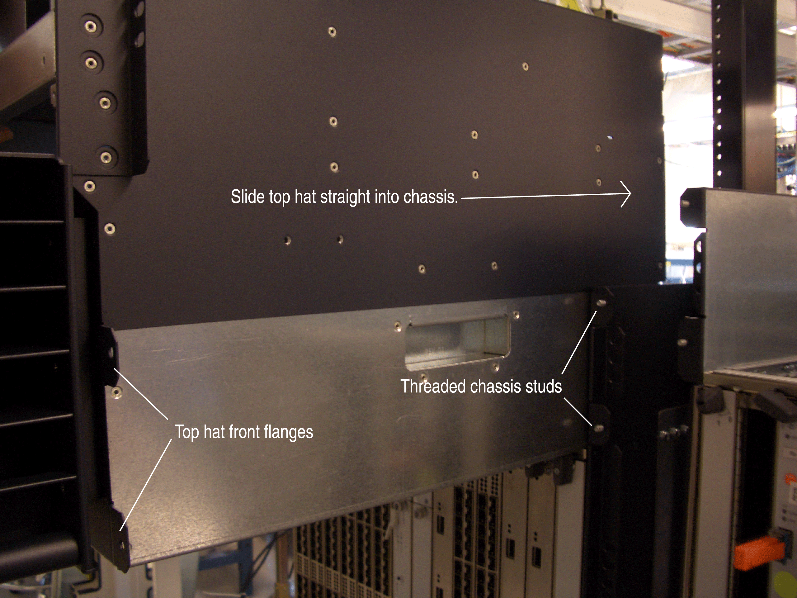 Server rack assembly guide showing labeled components: Slide top hat straight into chassis; Top hat front flanges; Threaded chassis studs.