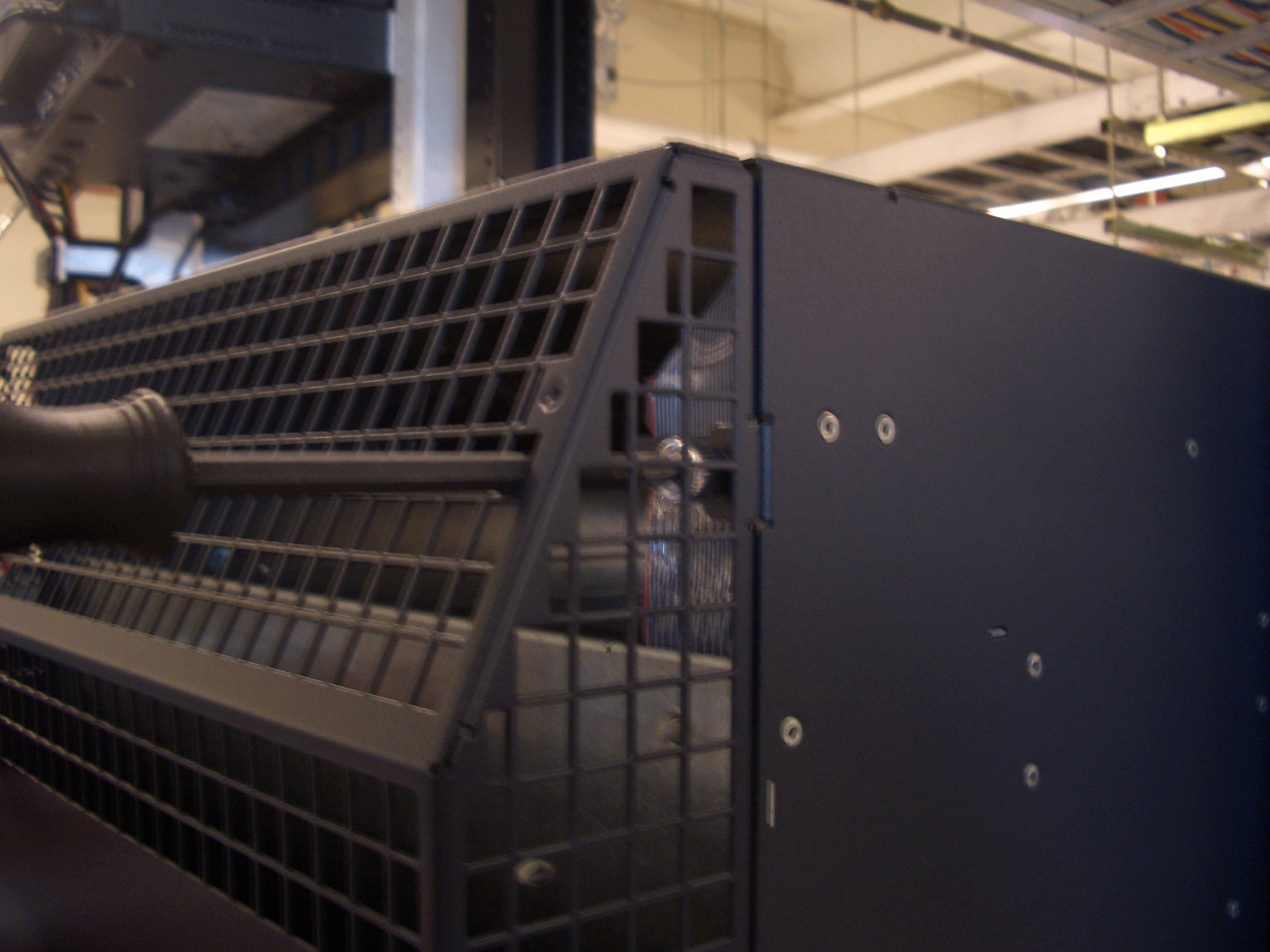 Close-up of black metal server rack with grid structure and ventilation design suggesting durability and airflow.