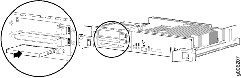 Close-up of a removable module being inserted into a blade server chassis, illustrating hardware installation.