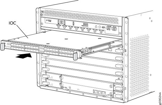 Juniper Input Output Card being inserted into or removed from a network device chassis in a switch or router.