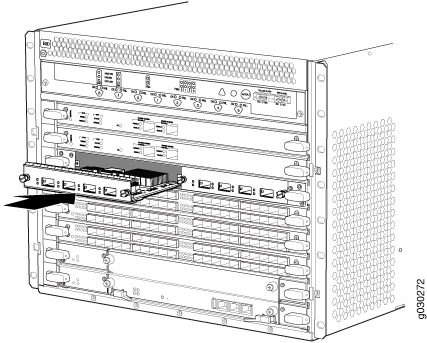 Network switch chassis with slots for modular components, showing a card being inserted or removed. Emphasizes airflow with perforated panels.