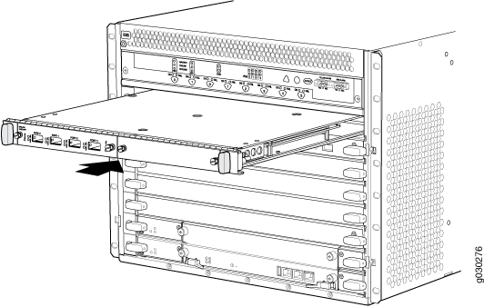 Line card being inserted into network switch chassis with multiple slots for scalability.