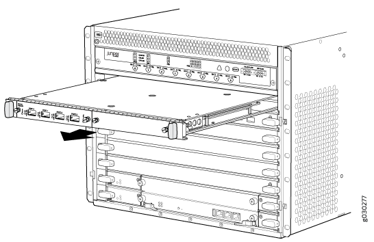 Line card being inserted into a Juniper Networks chassis for additional network connectivity.