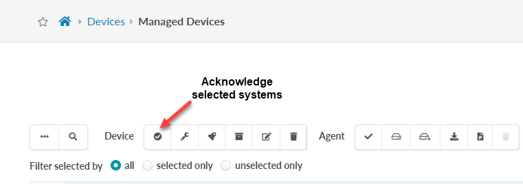 User interface for managing devices with toolbar icons. A red arrow highlights the Acknowledge selected systems icon, a checkmark in a circle.