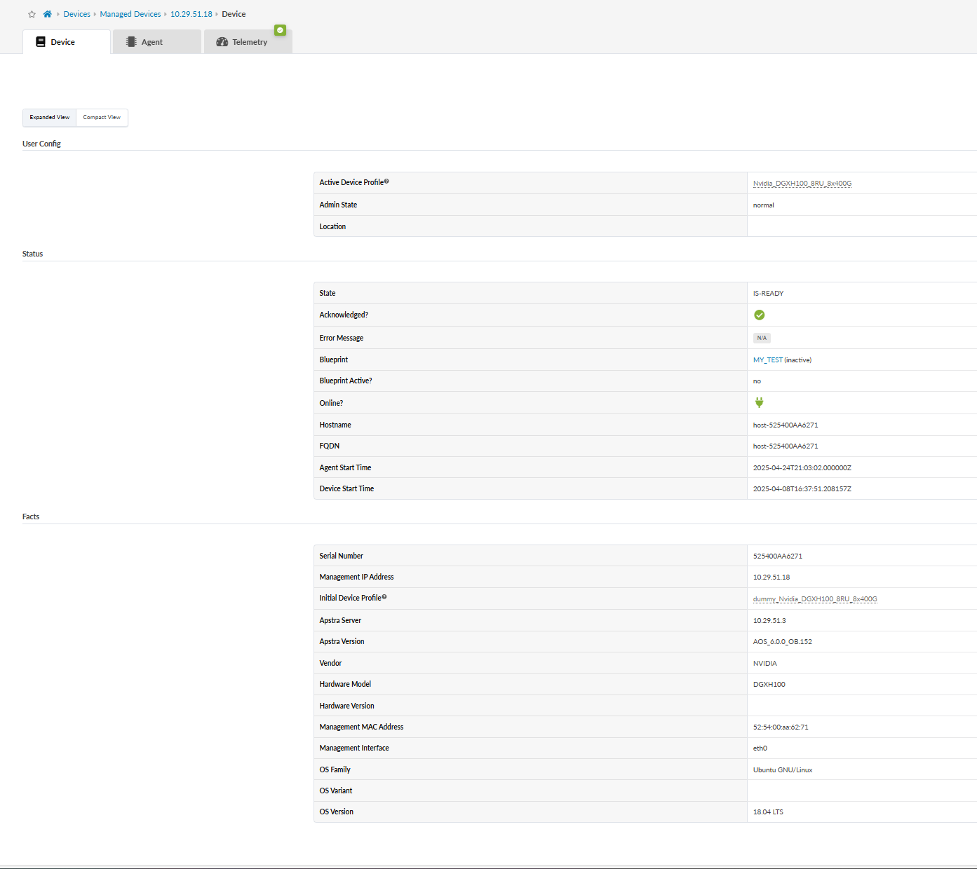 Device management interface screenshot showing detailed information about a managed device. Sections include User Config with Active Device Profile Nvidia_DGXH100_BRU_B4-000 and Admin State Normal; Status with State IS-READY and online status Yes; and Facts with Serial Number 525400A4A271, Management IP 10.29.51.18, Vendor NVIDIA, Hardware Model DGXH100, OS Family Ubuntu GNU/Linux, and OS Variant 18.04 LTS.