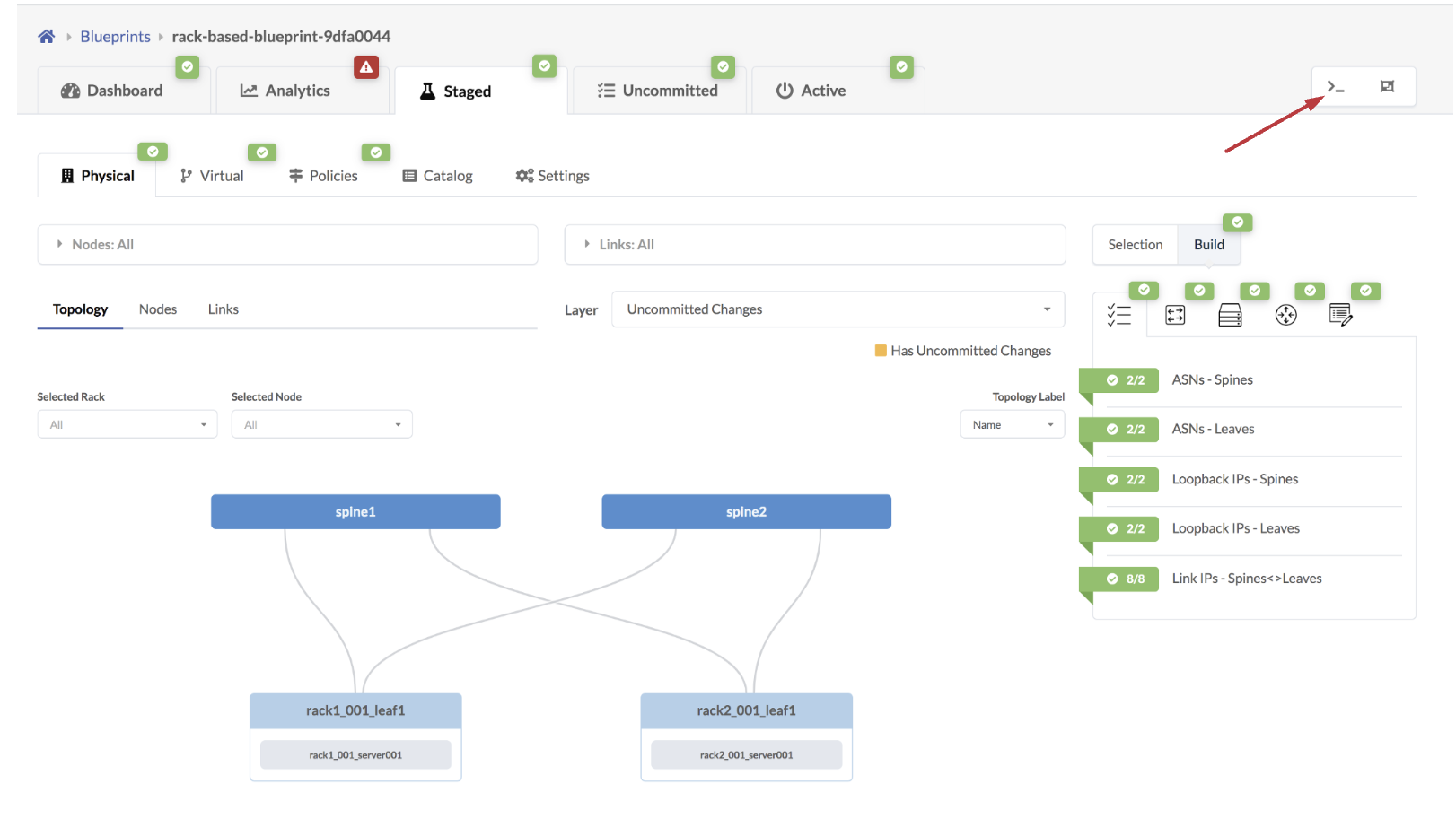 Network management interface showing a topology diagram with spine1 and spine2 connected to rack1_001_leaf1 and rack2_001_leaf1, linked to servers. Tabs for Physical, Virtual, Policies views, and indicators for uncommitted changes and configuration statuses are present.