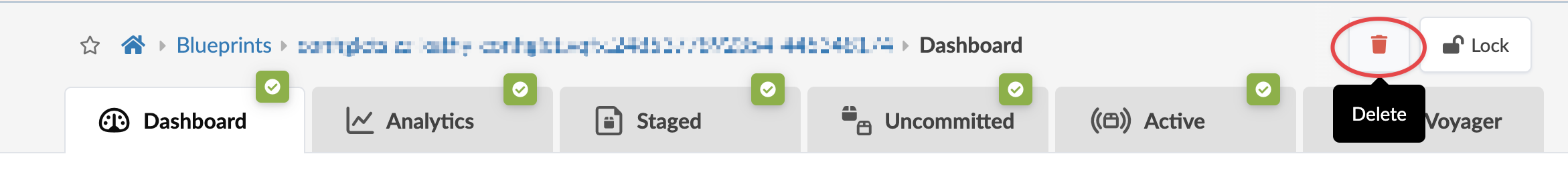 User interface screenshot with navigation tabs labeled Dashboard, Analytics, Staged, Uncommitted, Active, and Voyager, each marked with a green checkmark. A Delete button with a trash can icon and a Lock button are on the right. Breadcrumb navigation shows Blueprints and Dashboard, indicating a specific project view.