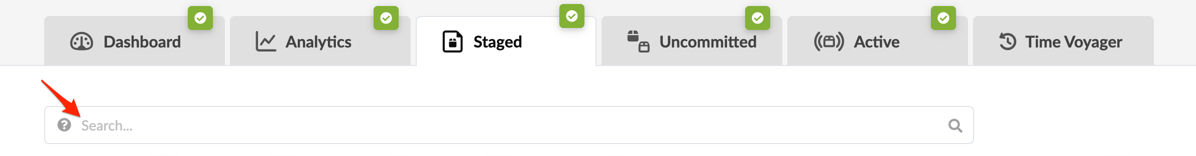 User interface with navigation tabs: Dashboard, Analytics, Staged, Uncommitted, Active, Time Voyager, all active. Arrow highlights question mark icon in search bar.