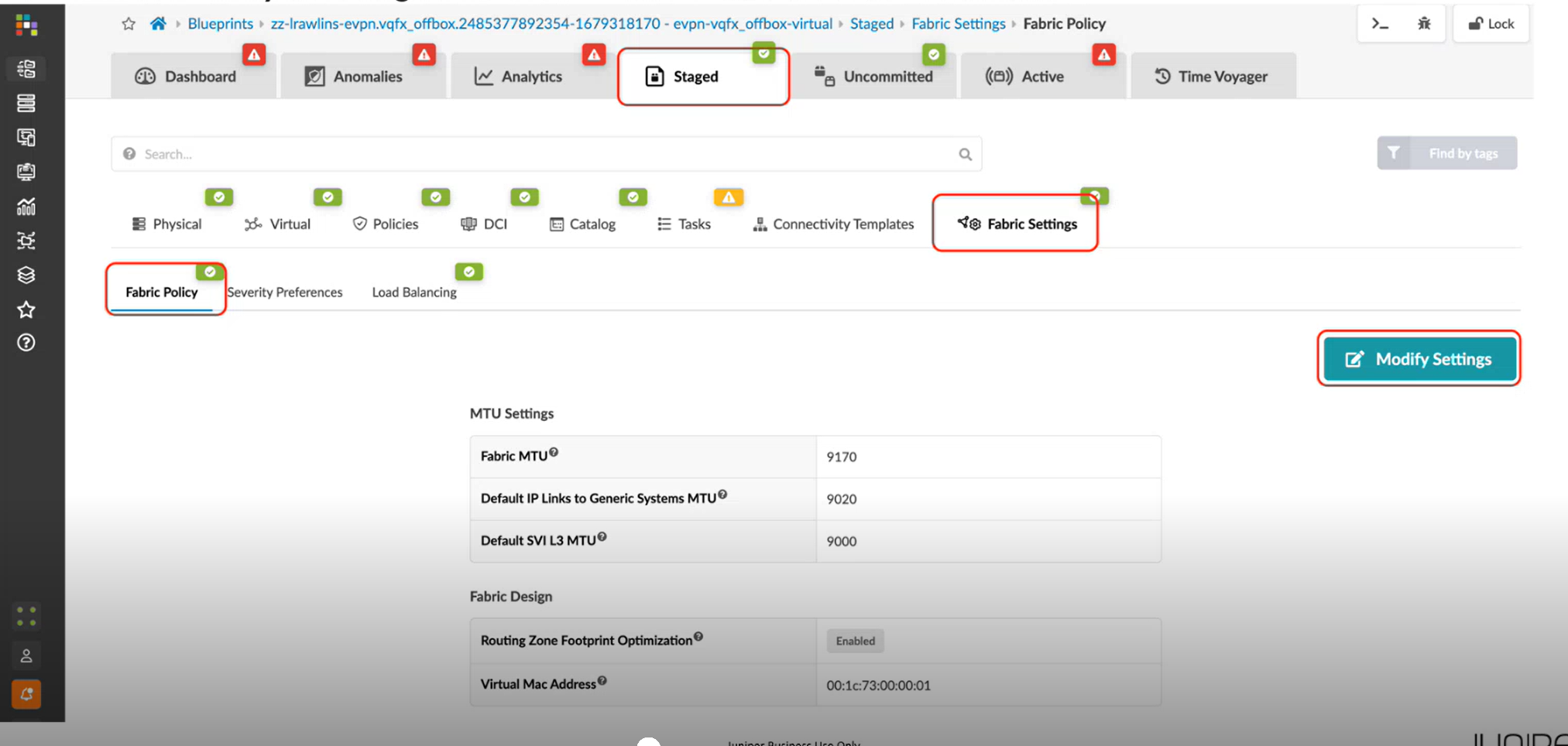 User interface of a network tool showing Fabric Settings in the Staged tab under Fabric Policy. MTU settings include Fabric MTU 9170, Default IP Links MTU 9020, and Default SVI MTU 9000. Routing Zone Footprint Optimization is enabled. Virtual MAC Address is 00:1c:73:00:00:01. Modify Settings button available. Tabs like Dashboard, Anomalies, Analytics, Staged, Uncommitted, Active, and Time Voyager are at the top.