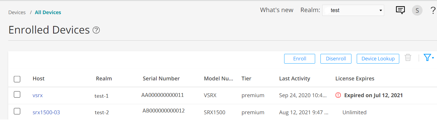 Dashboard interface for enrolled devices in a network management system listing host, realm, serial and model numbers, tier, last activity, and license expiration status.