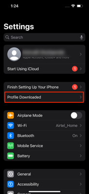 iPhone Settings screen in dark mode showing options for Start Using iCloud, Finish Setting Up Your iPhone, Profile Downloaded, Airplane Mode, Wi-Fi, Bluetooth, Mobile Service, and Battery.