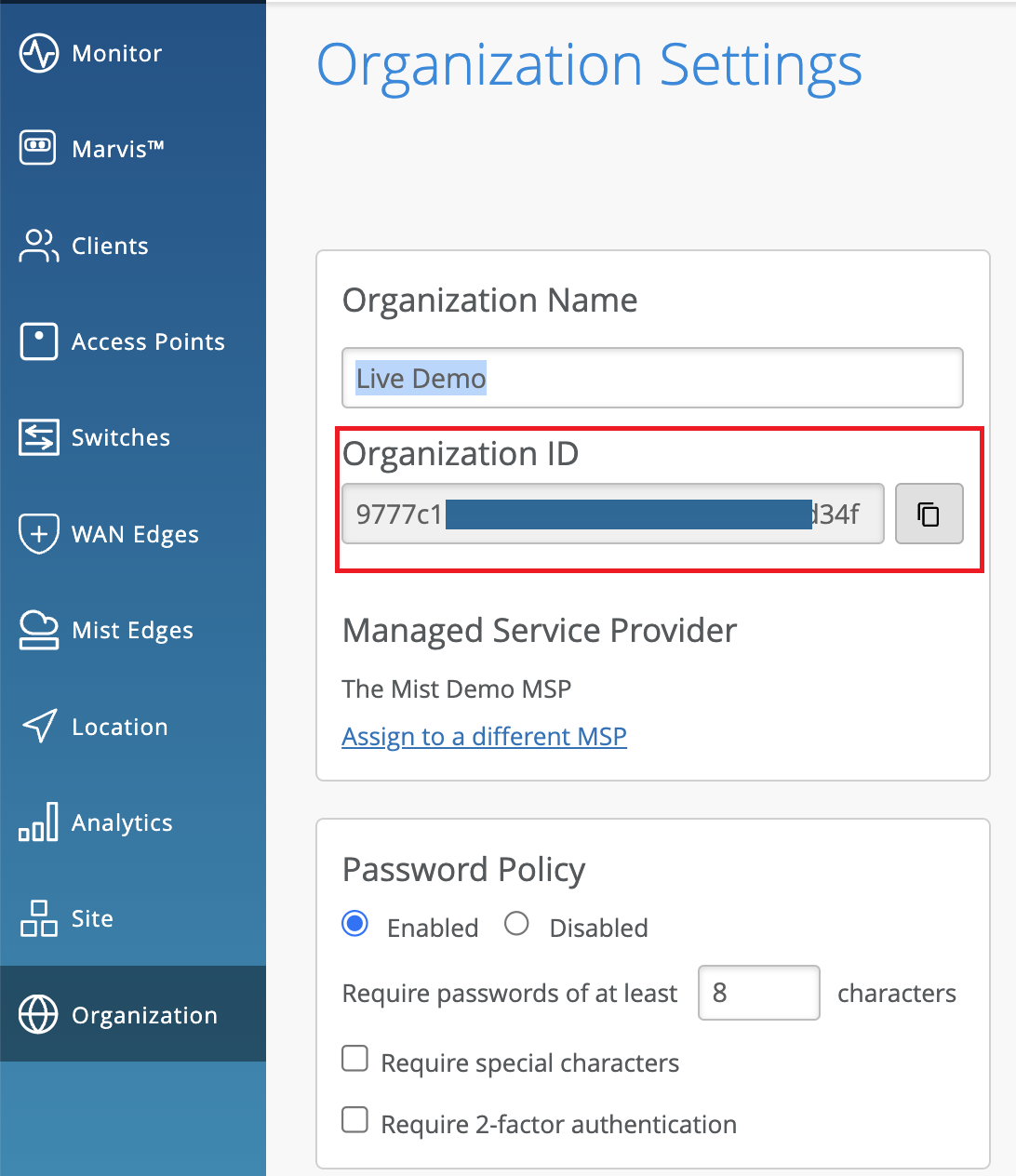 Organization Settings page showcasing organization name Live Demo, organization ID partially visible in red, MSP set to The Mist Demo MSP, password policy enabled with 8-character minimum, no special character or 2FA requirement, and a navigation menu for IT management features like Monitor, Clients, and Access Points.