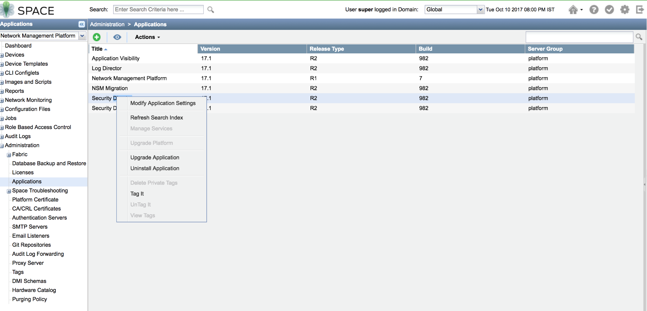 Screenshot of Junos Space Network Management Platform's Applications section under Administration, listing applications with titles, versions, release types, builds, and server groups. An Actions menu for Security Director is open, showing Modify, Refresh, Upgrade, Uninstall, and Tagging options. Navigation panel with Dashboard, Devices, and more on the left. User "super" in Global domain, with date Tue Oct 10 2017 08:00 PM IST. Search bar at the top.